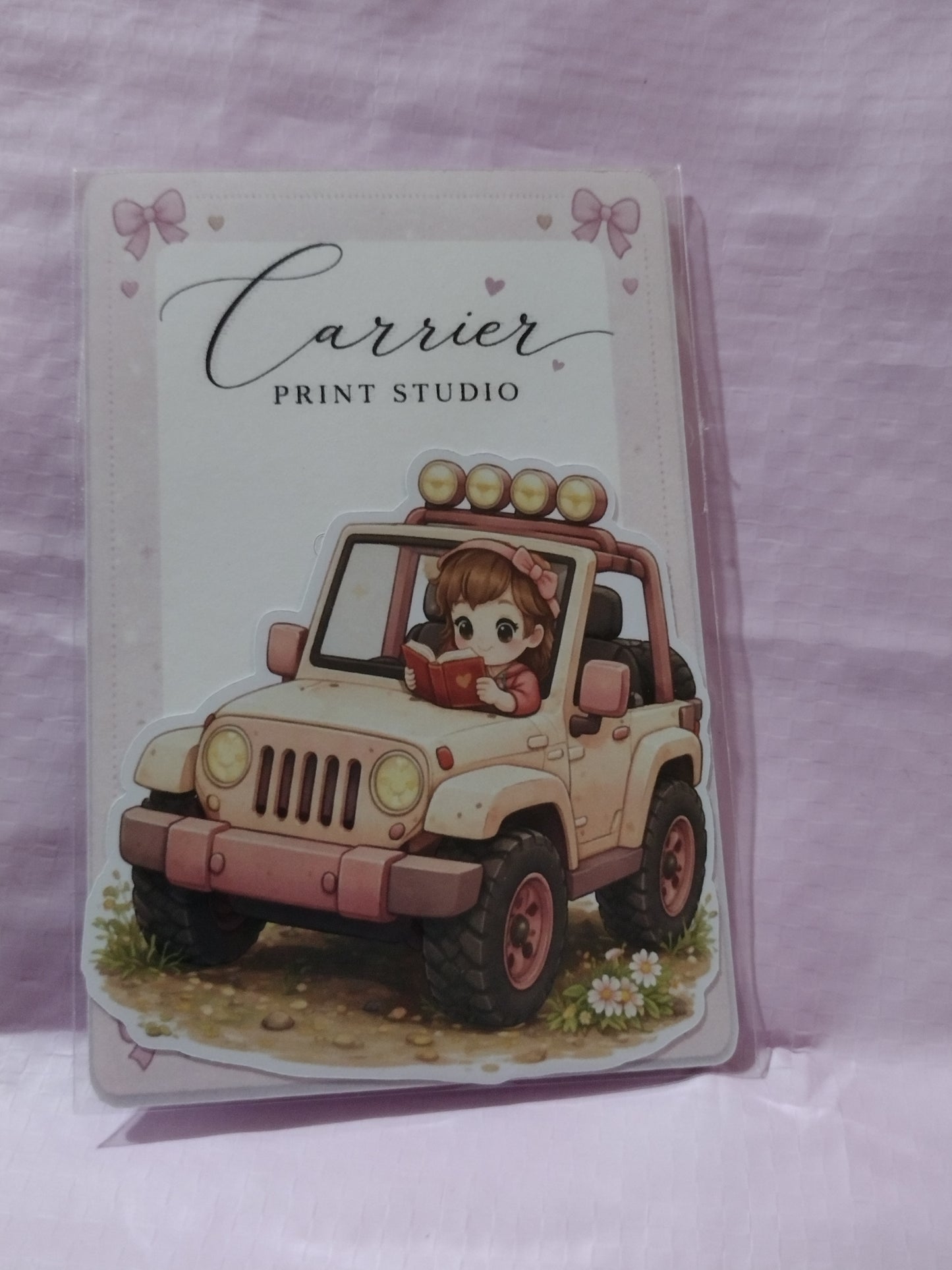 GIRL IN PINK JEEP READING 3X3 DIE CUT STICKER